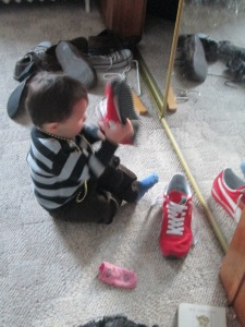 Every time Lucas gets any opportunity to put on someone else's shoes he will. He has been especially fond of your red sneakers.
